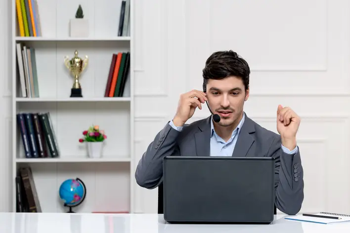 customer-service-cute-guy-grey-suit-with-computer-headset-having-videocall_708x472 customer-service-cute-guy-grey-suit-with-computer-headset-having-videocall_708x472